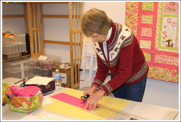 Sandy cutting her fabric.