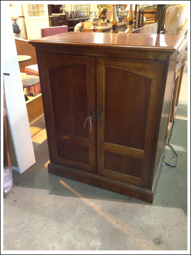 Cherry-finish armoire.