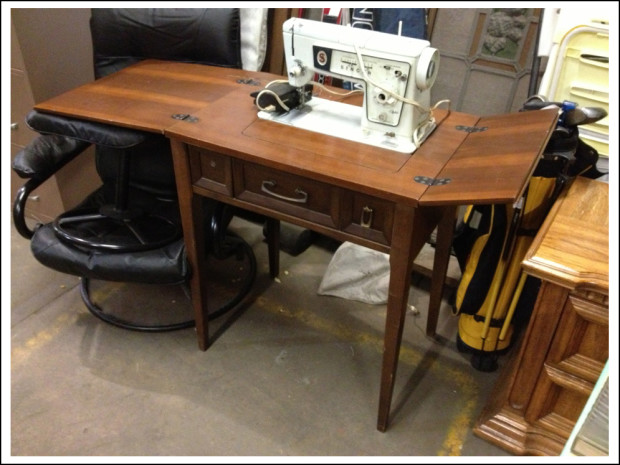 Singer sewing machine and table.